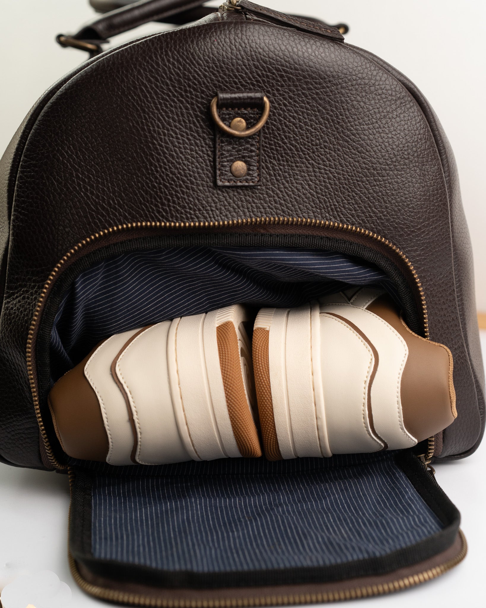brown leather backpack duffle bag The Chase